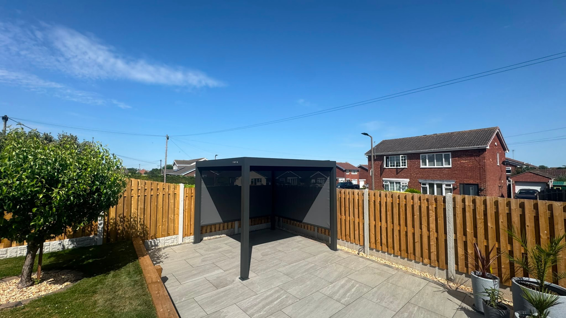Louvered pergola fitted with motorised zip screen side walls